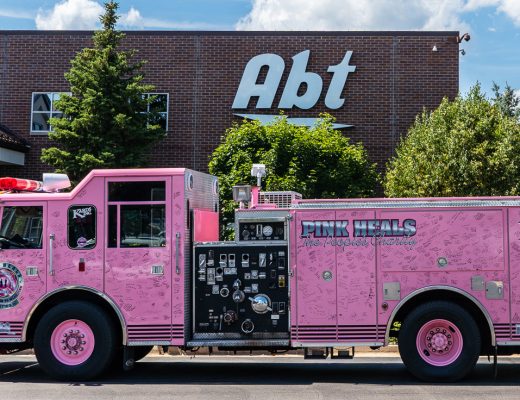 pink heals pink firetruck in front of Abt