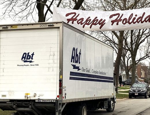 abt truck with happy holidays banner