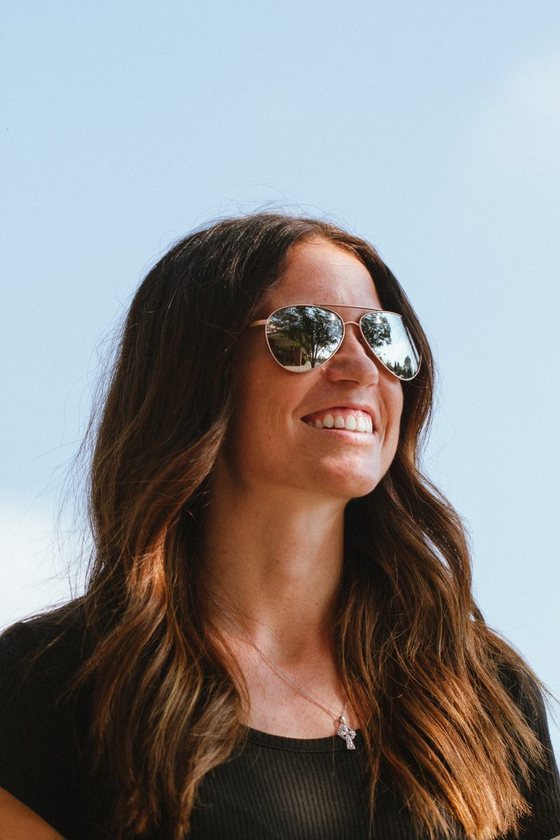 A woman wearing aviator sunglasses