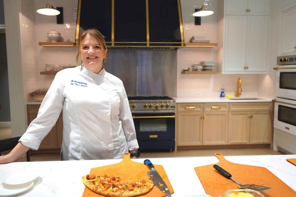 Chef Susan Swanson and her Italian Beef-inspired pizza in our BlueStar kitchen
