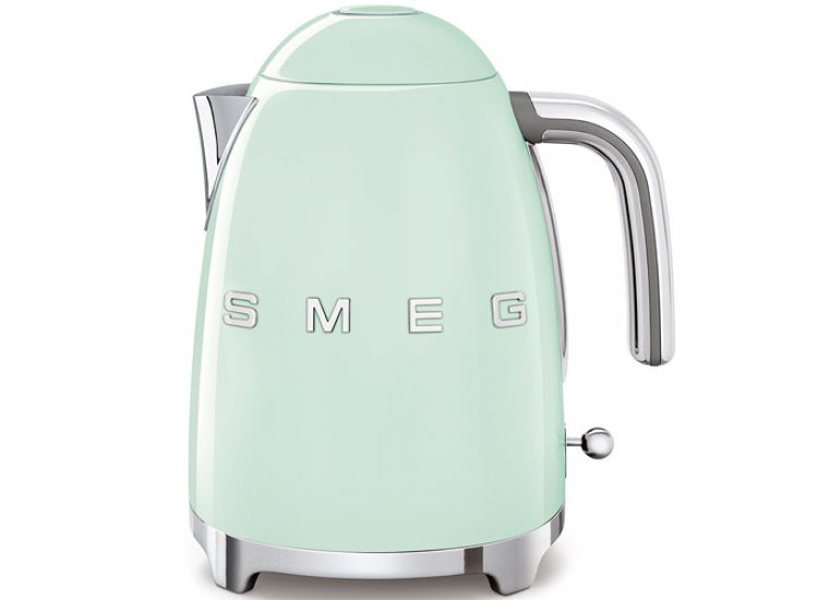 pastel green smeg tea kettle on white background