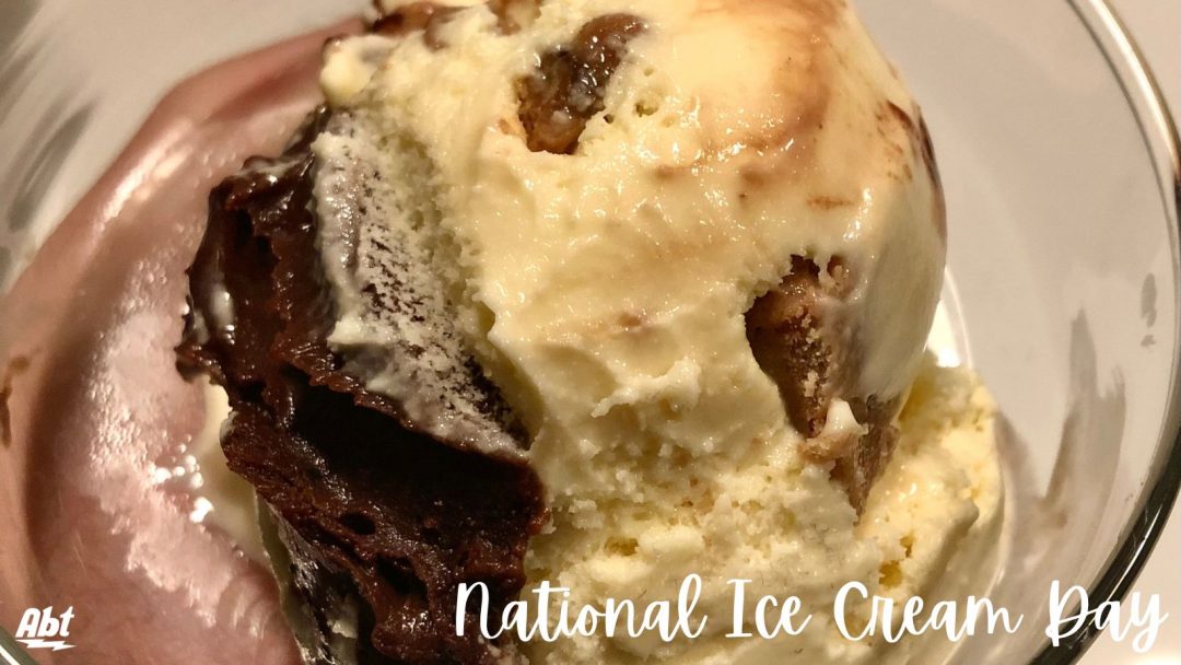 closeup of molasses cookie dough ice cream with "national ice cream day" in white text at the bottom of the image