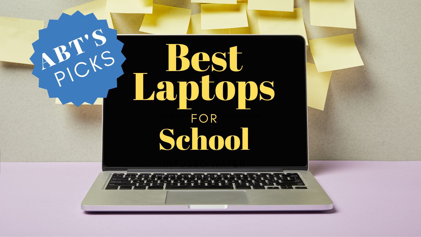 Silver laptop with yellow text on the screen that reads "best laptops for school"