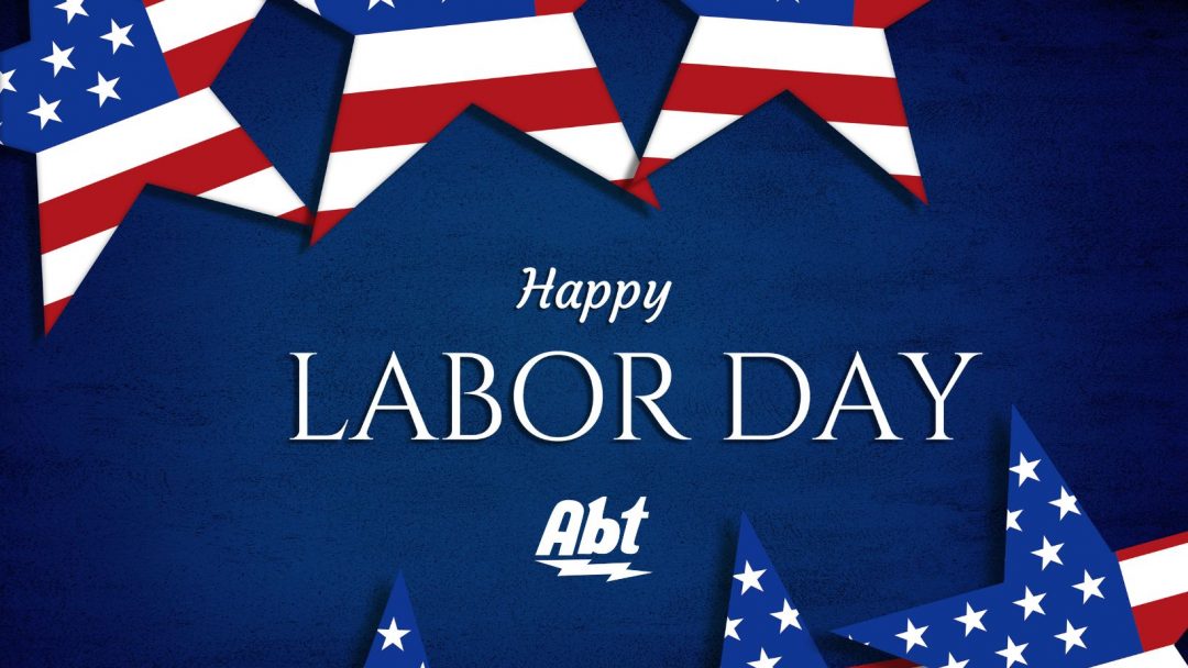 dark blue background with white text that reads "happy labor day" with the abt logo under the text