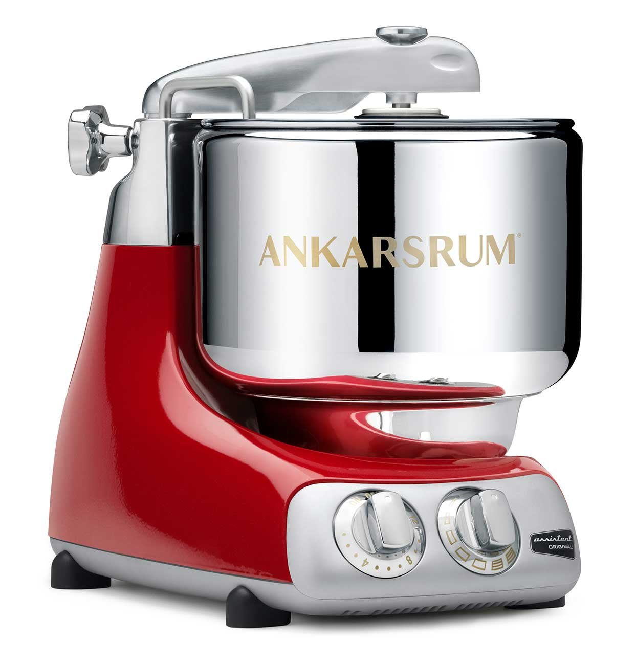 Angled shot of a red Ankarsrum stand mixer with a silver mixing bowl