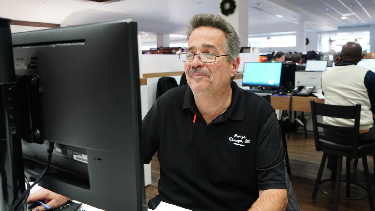George Mavraganis in front of a computer