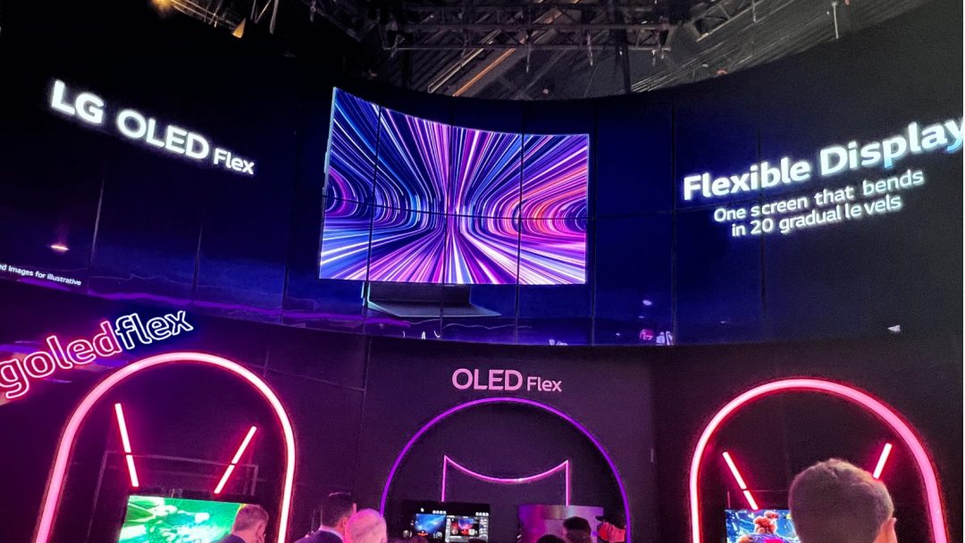 lg OLED Flex monitors on display with a group of people in front of them