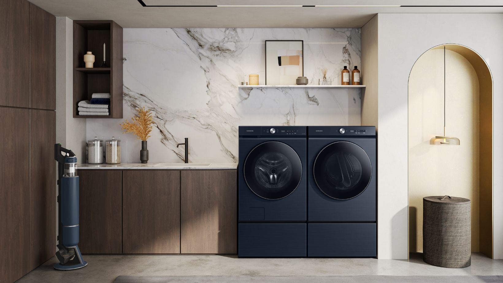 laundry room with navy Samsung Bespoke washer and dryer and navy Samsung Bespoke vacuum