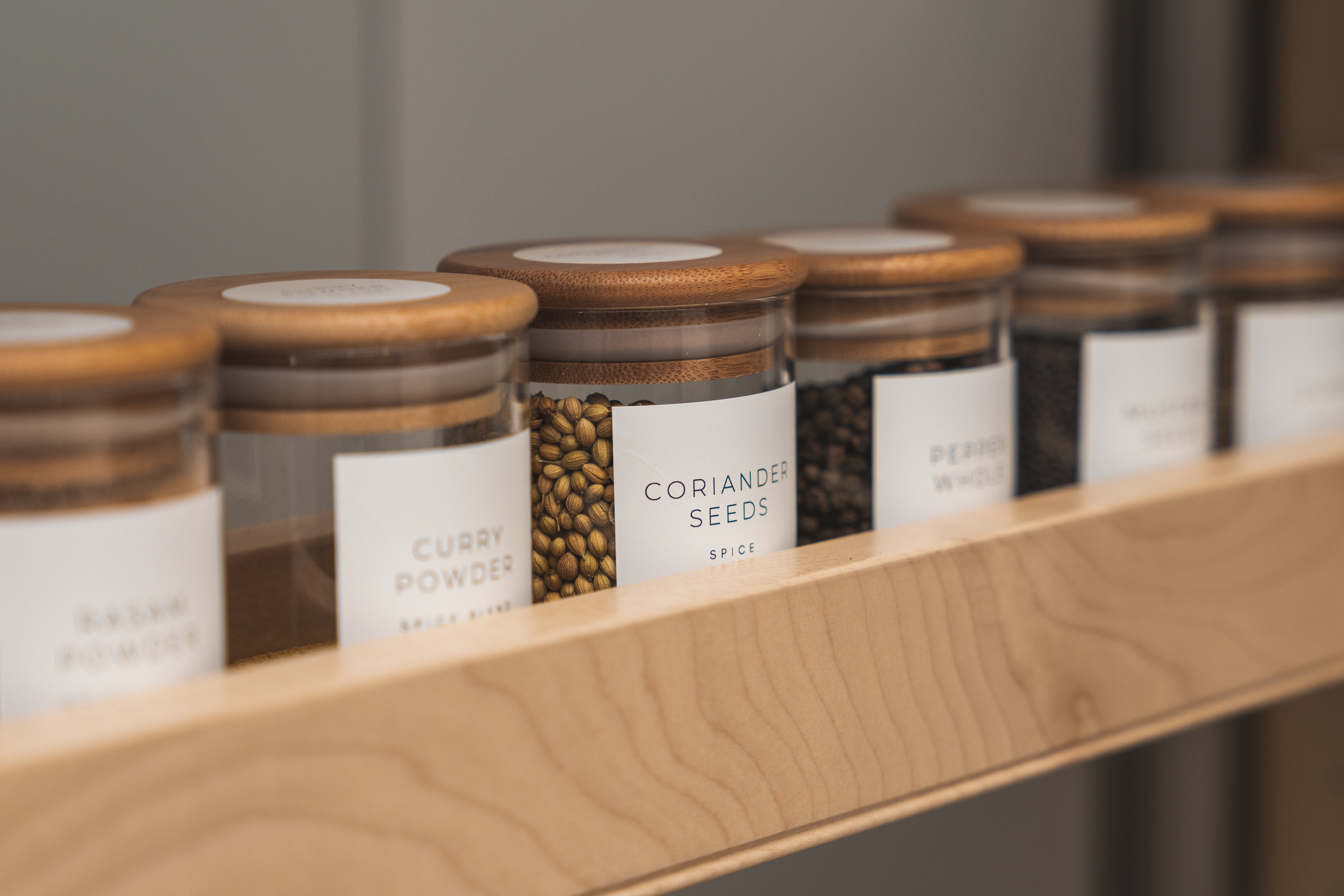 Clear spice containers with labels