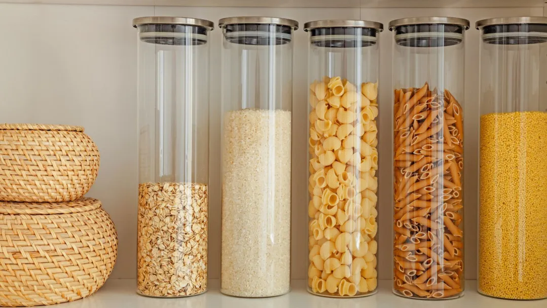 clear containers filled with dry ingredients on a shelf
