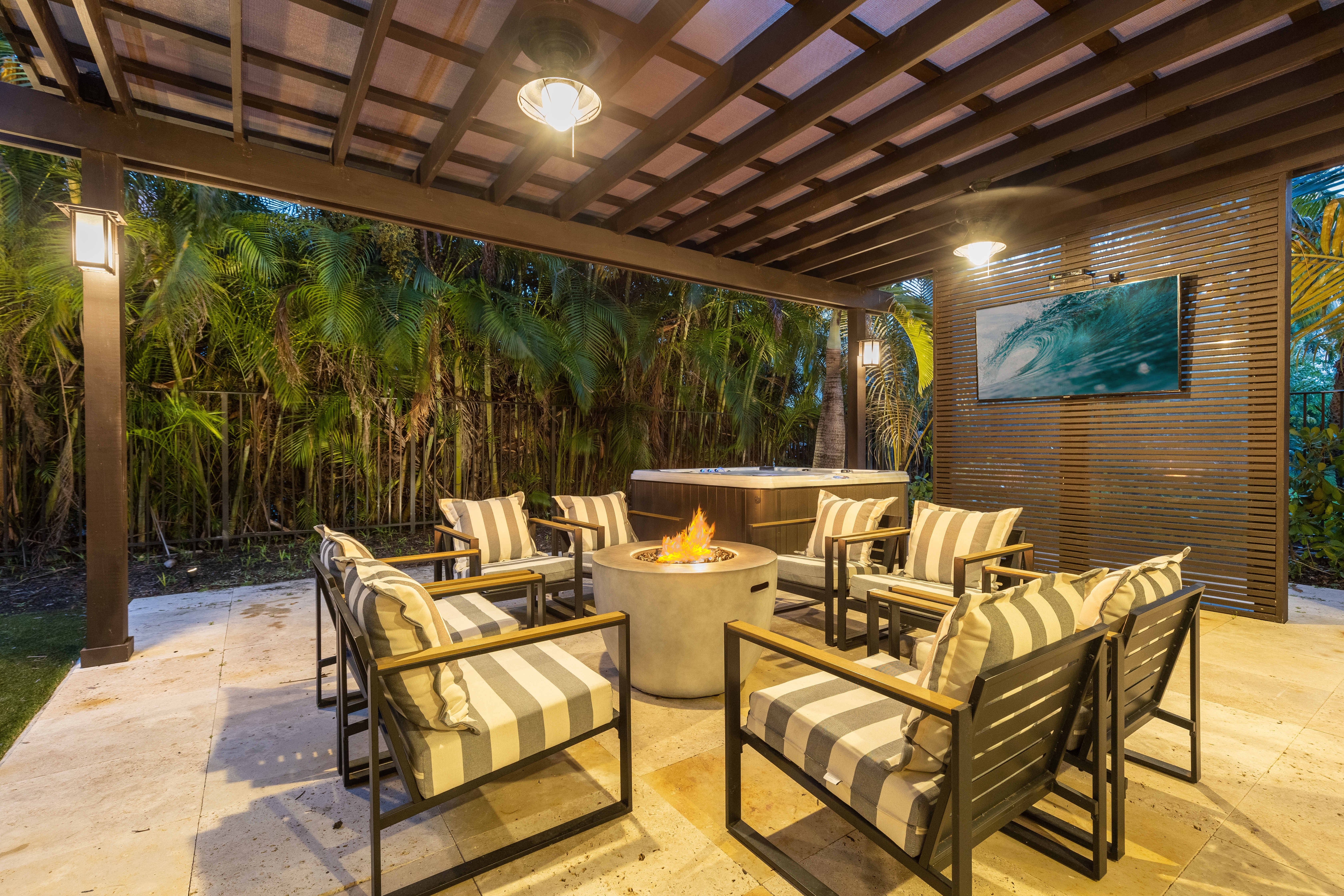 Outdoor firepit with furniture and outdoor TV.