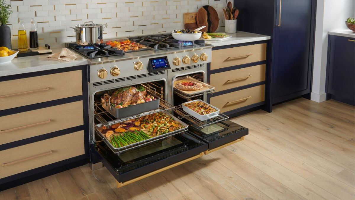 48" BlueStar Dual Fuel range in a kitchen; ovens filled with turkey and veggies.
