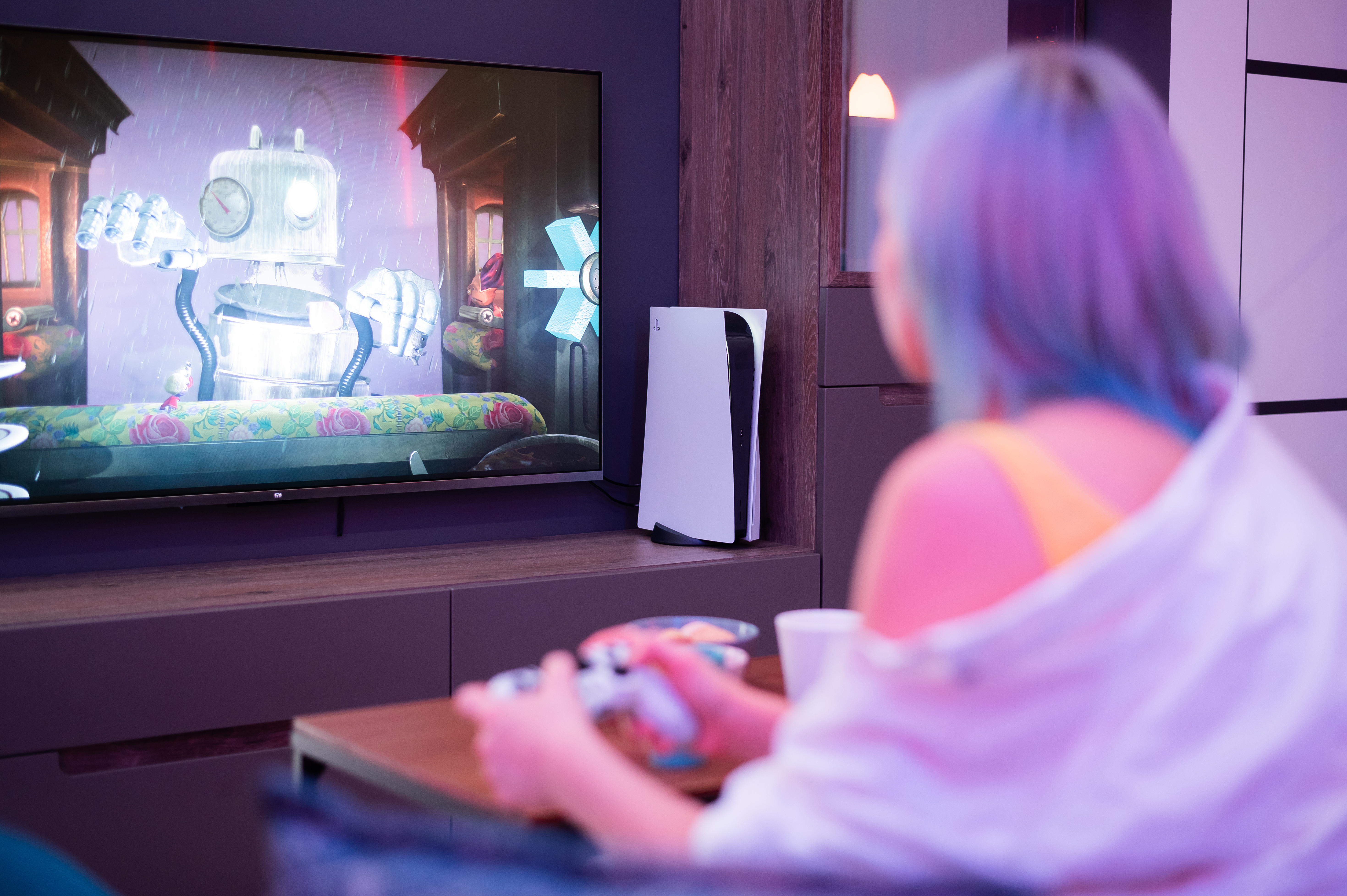 Girl playing on Playstation 5.