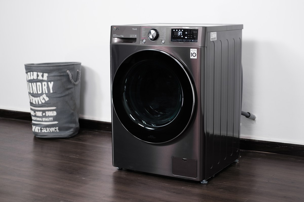 LG washer/dryer combo sitting in laundry room.