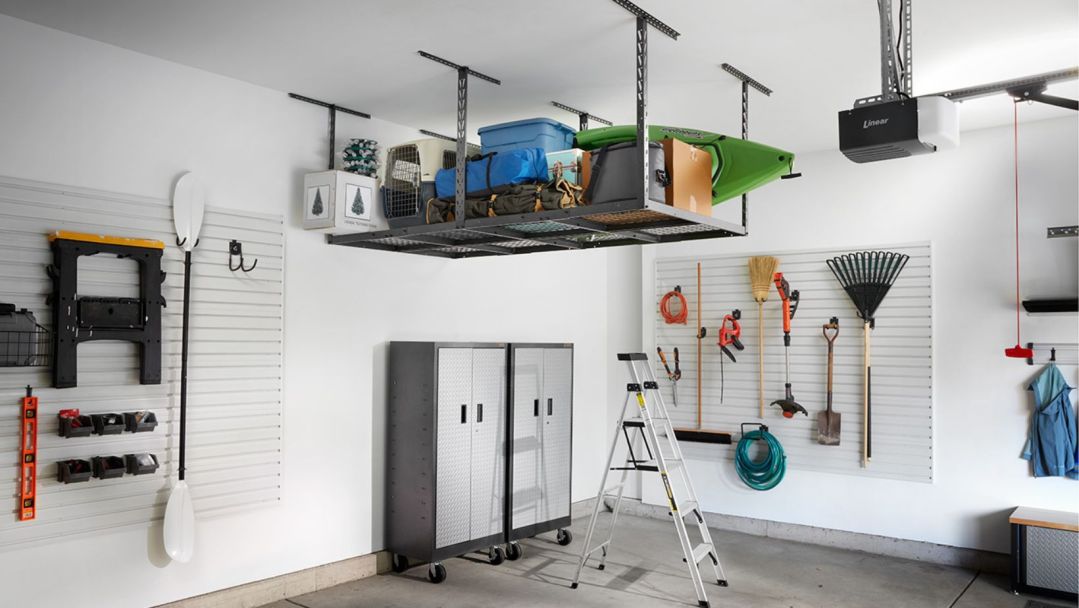 A well-organized garage with overhead storage, wall storage and closets