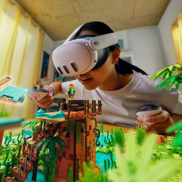 A young girl uses the mixed reality components that are a part of the Meta Quest 3
