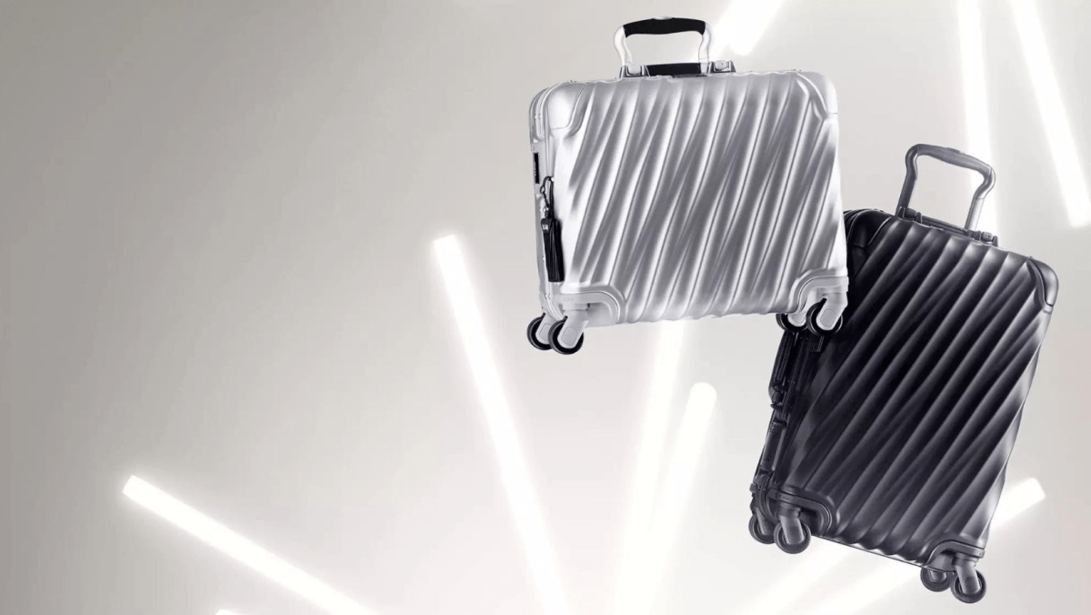 Two suitcases with shiny background, ready for travel.