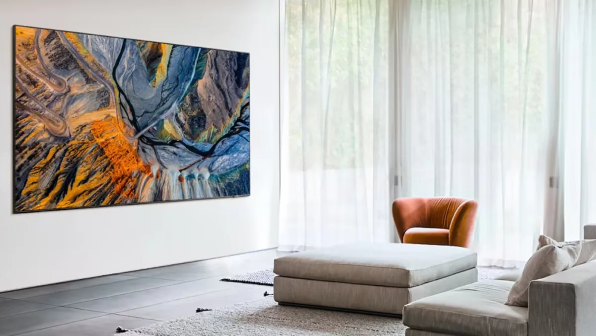 Samsung The Wall showcasing abstract landscape art in a living room with long curtains in front of the window