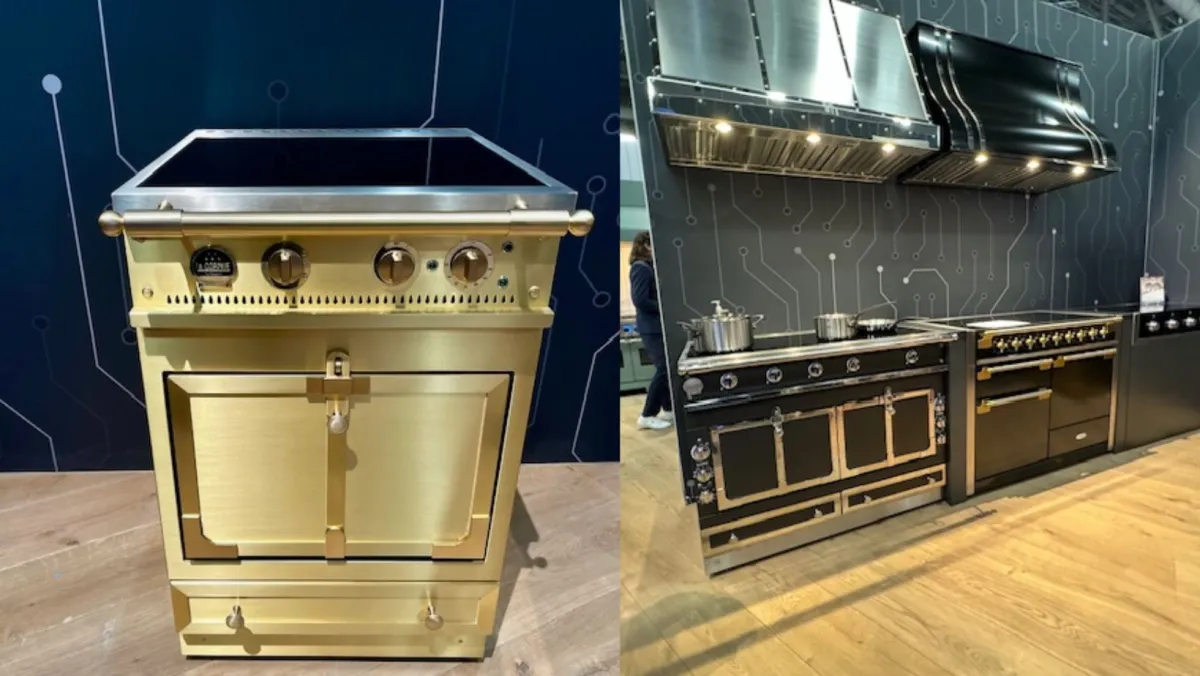 A la cornue Chateau range on the left in brushed brass, and two larger la cornue induction ranges complete with matching hoods on the right