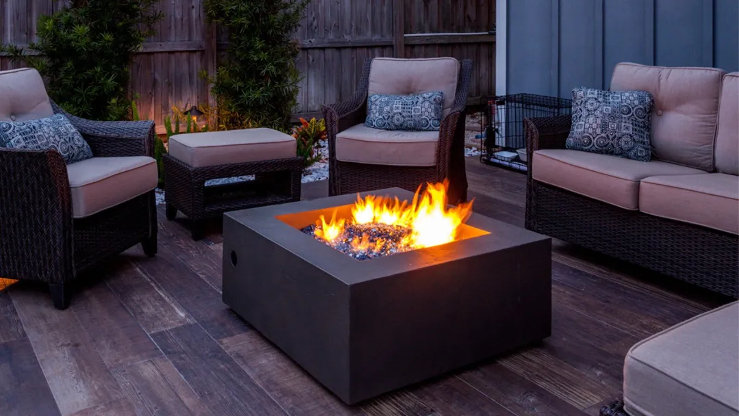 patio furniture surrounding a fire table