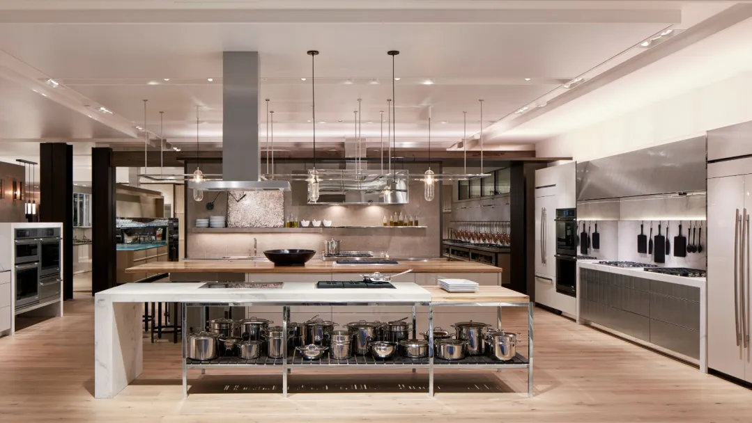 front view of a large kitchen with stainless steel appliances